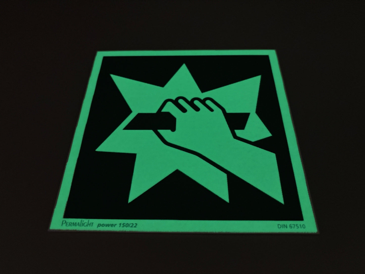 Fluchtwegschild Alu 150x150 Permalight power 150/22 "Notausgangsvorrichtung, die nach Zerschlagen einer Scheibe erreichbar ist"